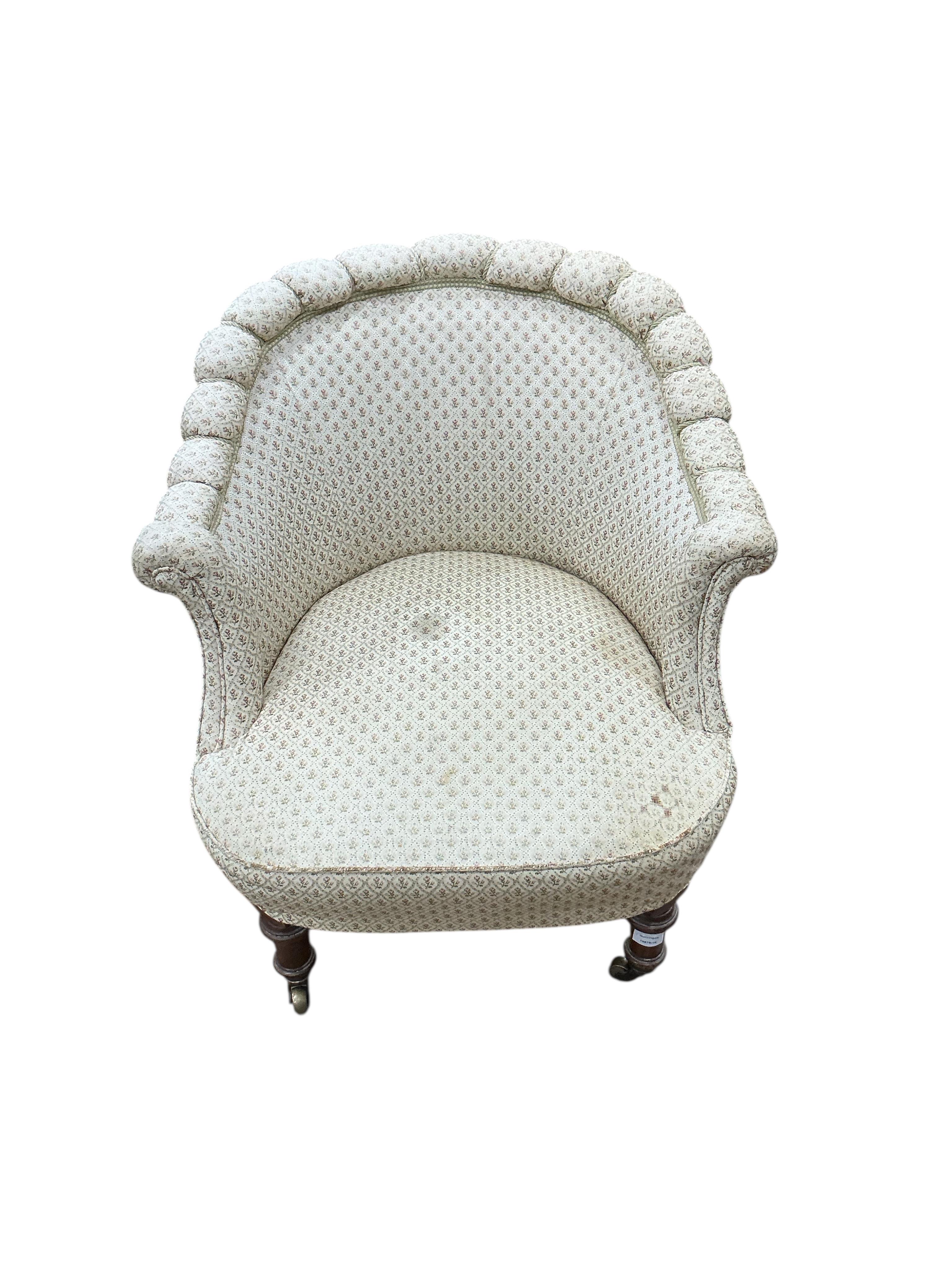 An early Victorian upholstered armchair, width 74cm, depth 76cm, height 74cm
